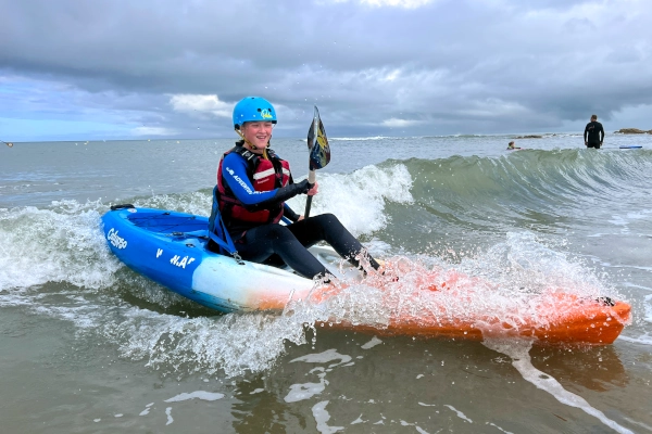 sea kayak playing with wave at Aberporth Ceredigion