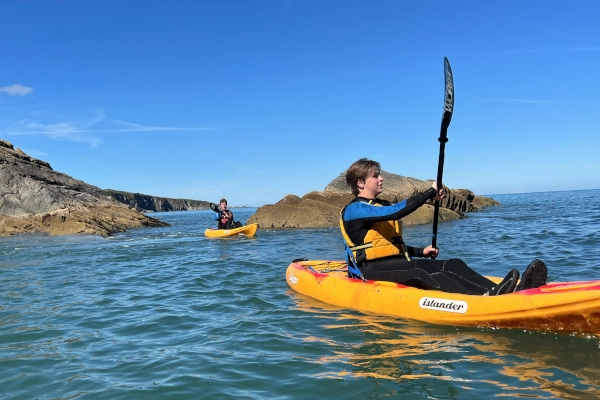 sea kayak exploring the coastline